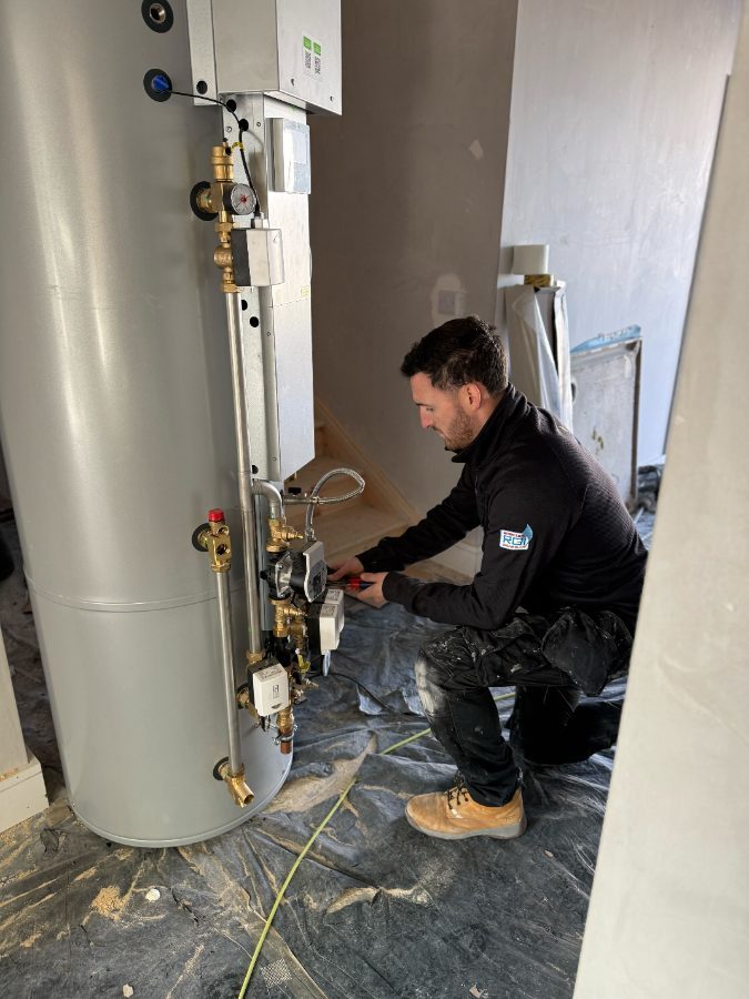 Heat pump cylinder and pipework installation on a live domestic job